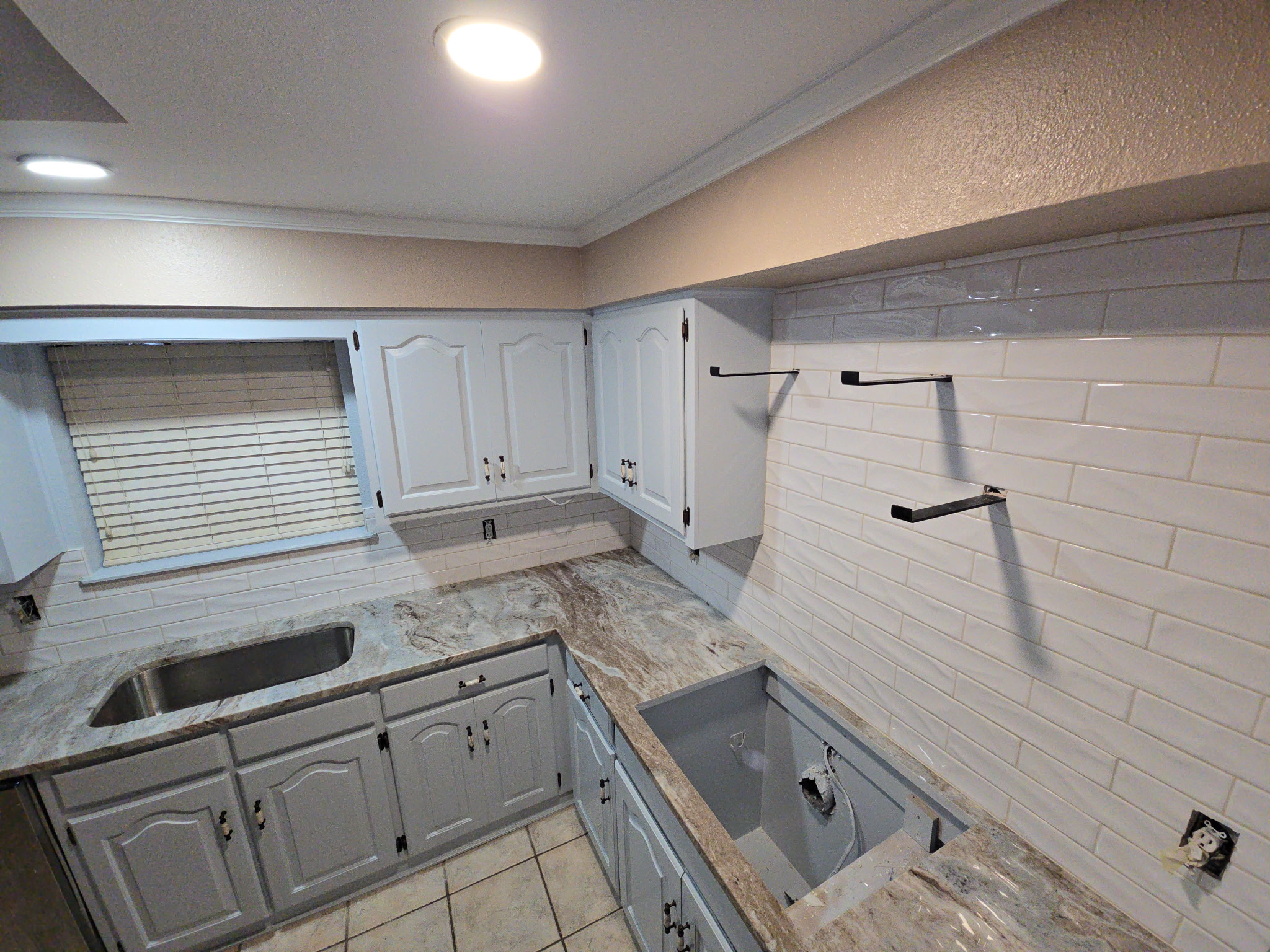 White subway tile kitchen backsplash installation by JPond Custom Tile