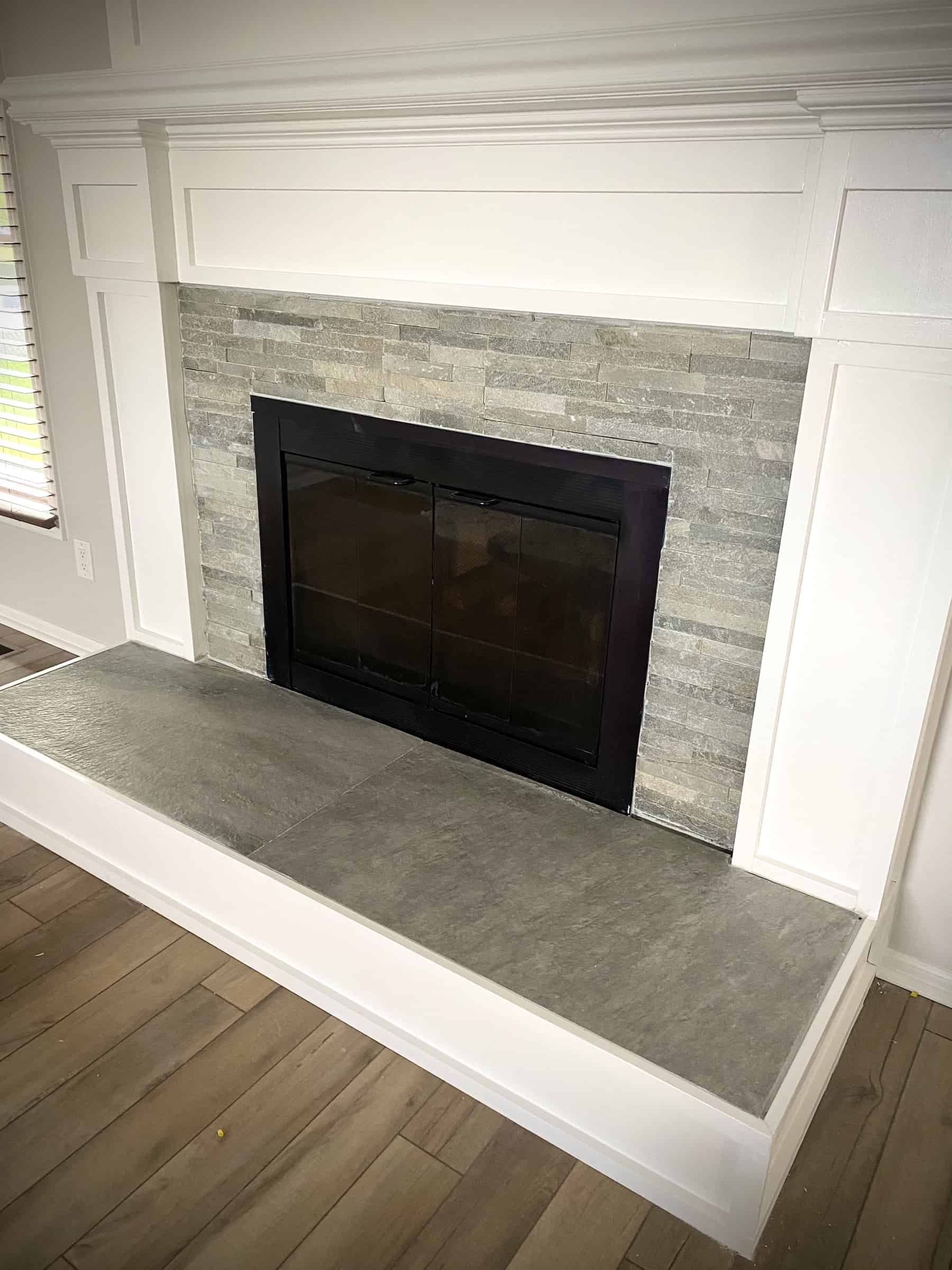 Modern fireplace tile surround with large format tile