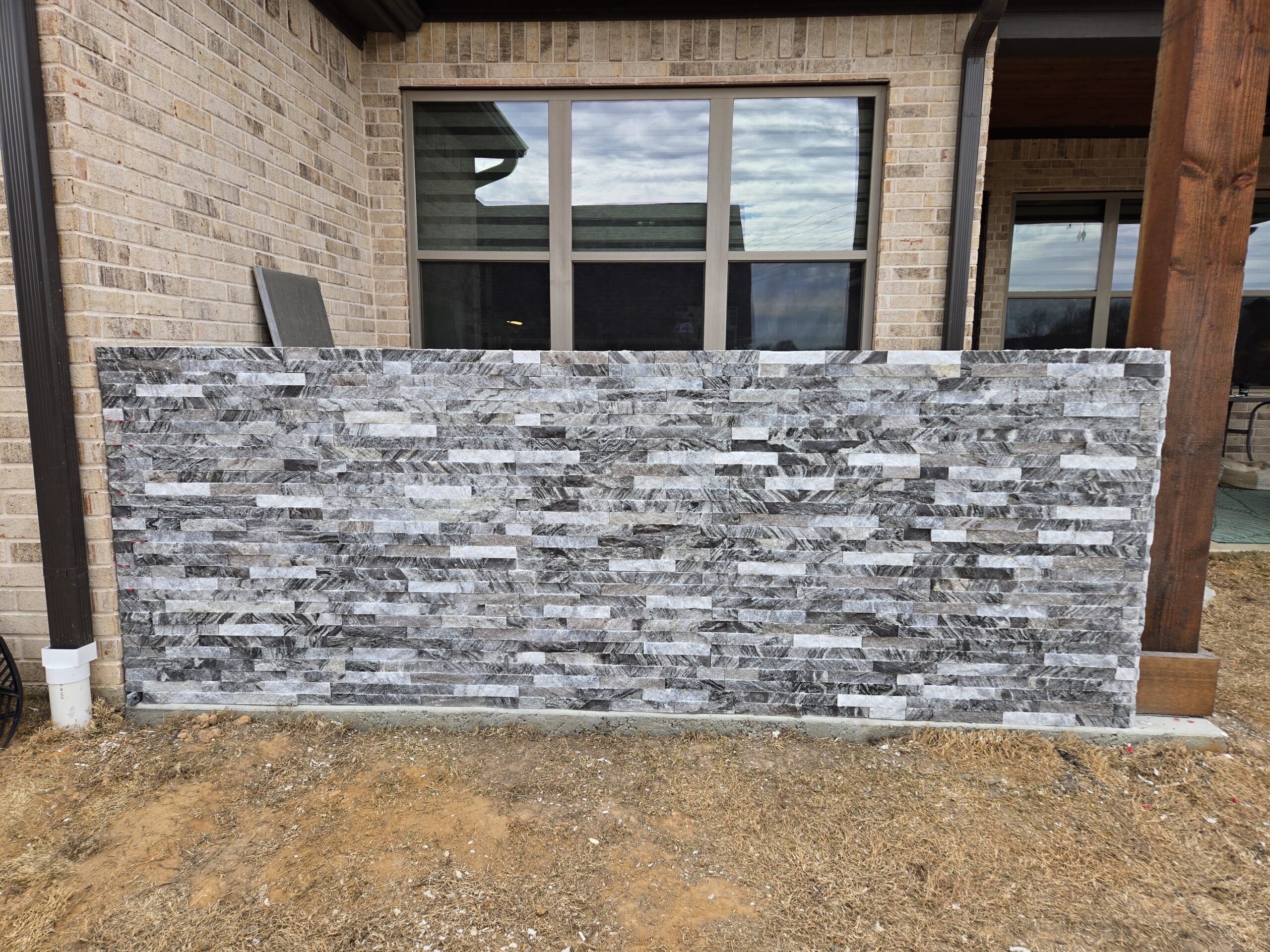 Exterior stone tile installation on outdoor wall by JPond Custom Tile Tyler TX